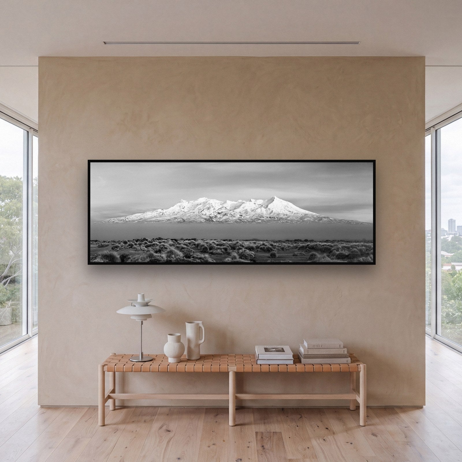 Large black and white fine art print of Mount Ruapehu by Stephen Milner, shown in a styled interior