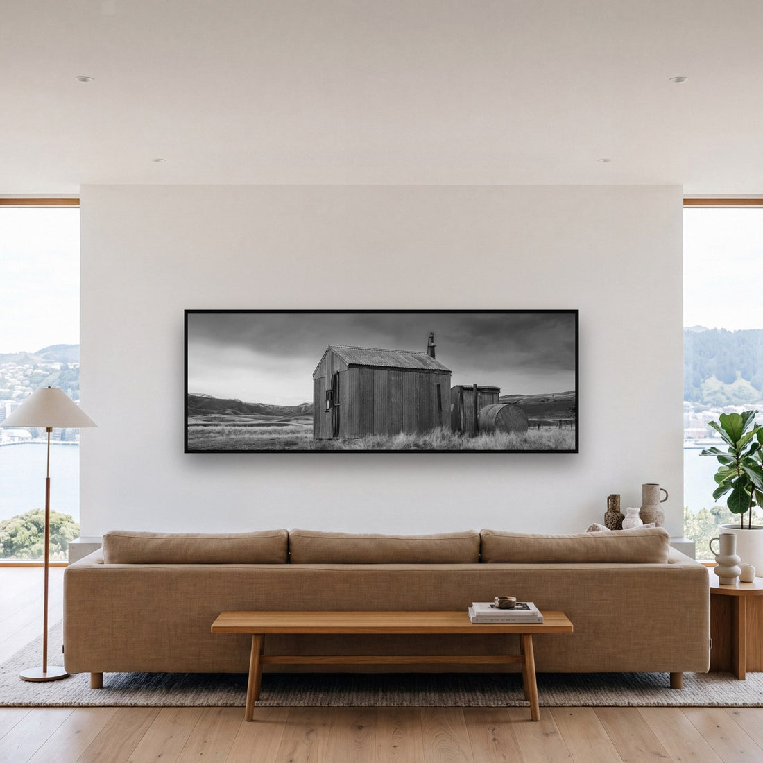 Large black and white fine art print of a minimalist landscape by Stephen Milner, shown in a styled interior