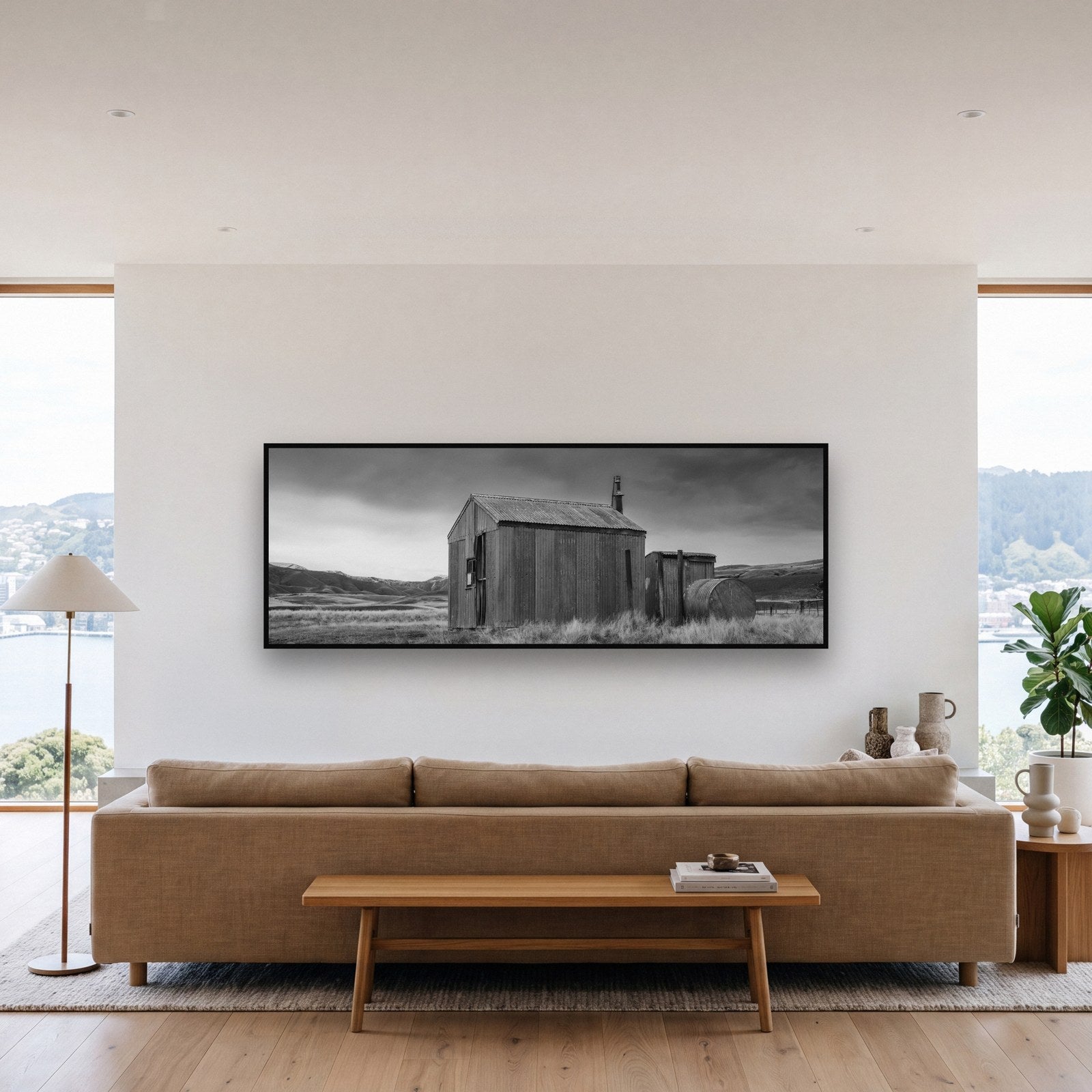 Large black and white fine art print of a minimalist landscape by Stephen Milner, shown in a styled interior