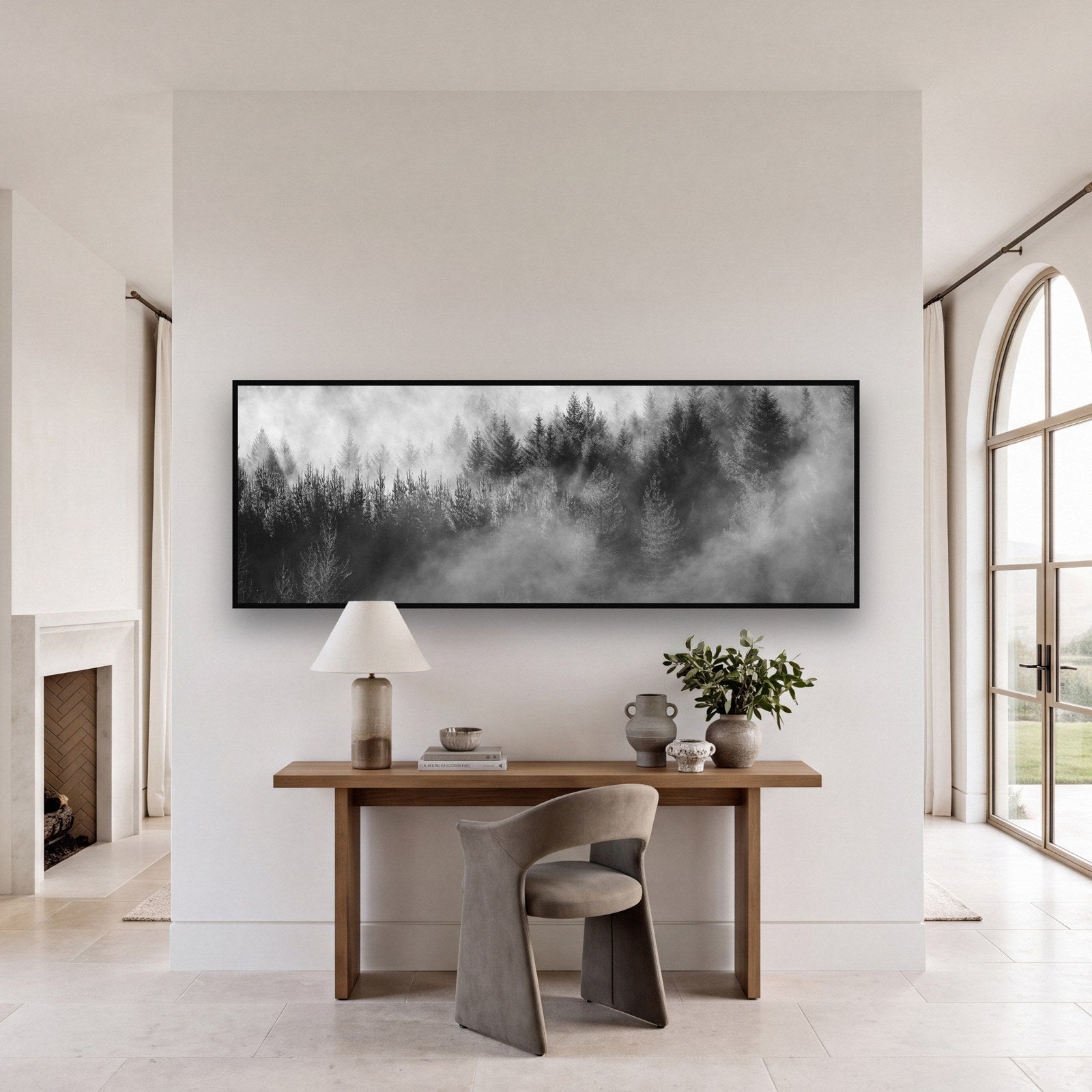 Large black and white fine art print of a redwood forest by Stephen Milner, shown in a styled interior