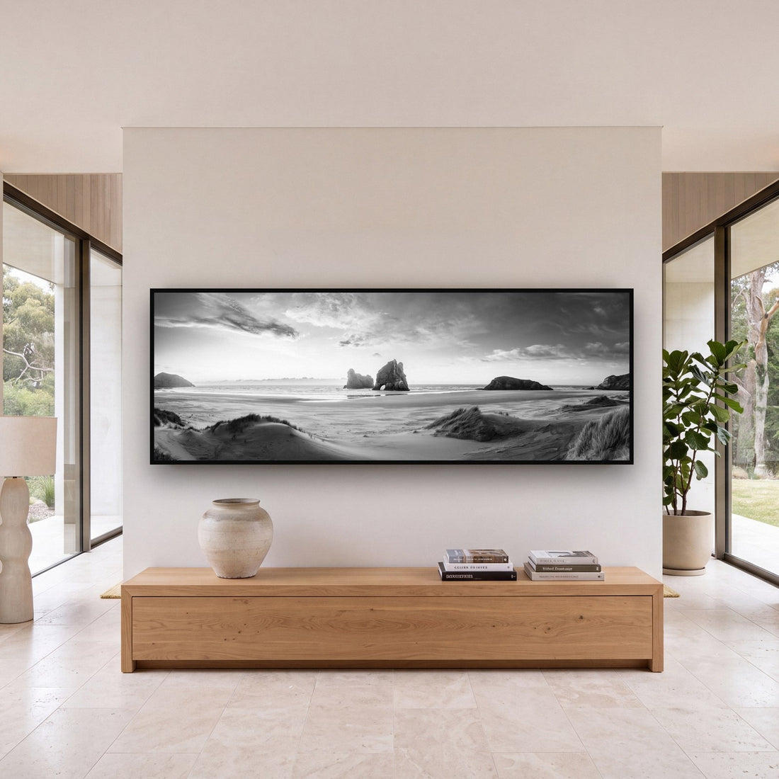 Large black and white fine art print of a desert landscape by Stephen Milner, shown in a styled interior