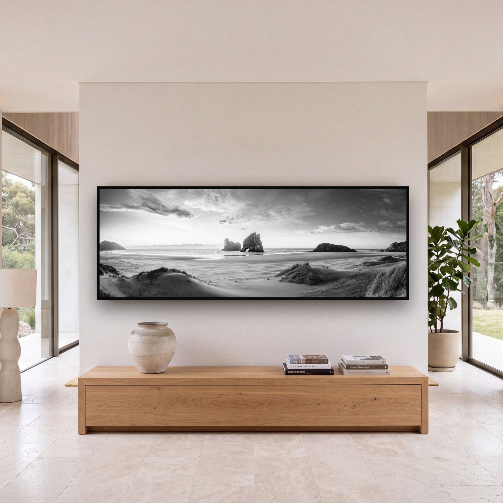 Large black and white fine art print of a desert landscape by Stephen Milner, shown in a styled interior