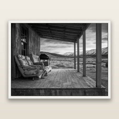 Alpine Retreat, Rustic Comfort Amidst Splendour, black and white framed metallic canvas print, White frame. New Zealand fine art wall art by Stephen Milner.
