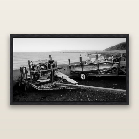 Boats in the Bay, Cape Palliser, black and white framed metallic canvas print, Black frame. New Zealand fine art wall art by Stephen Milner.