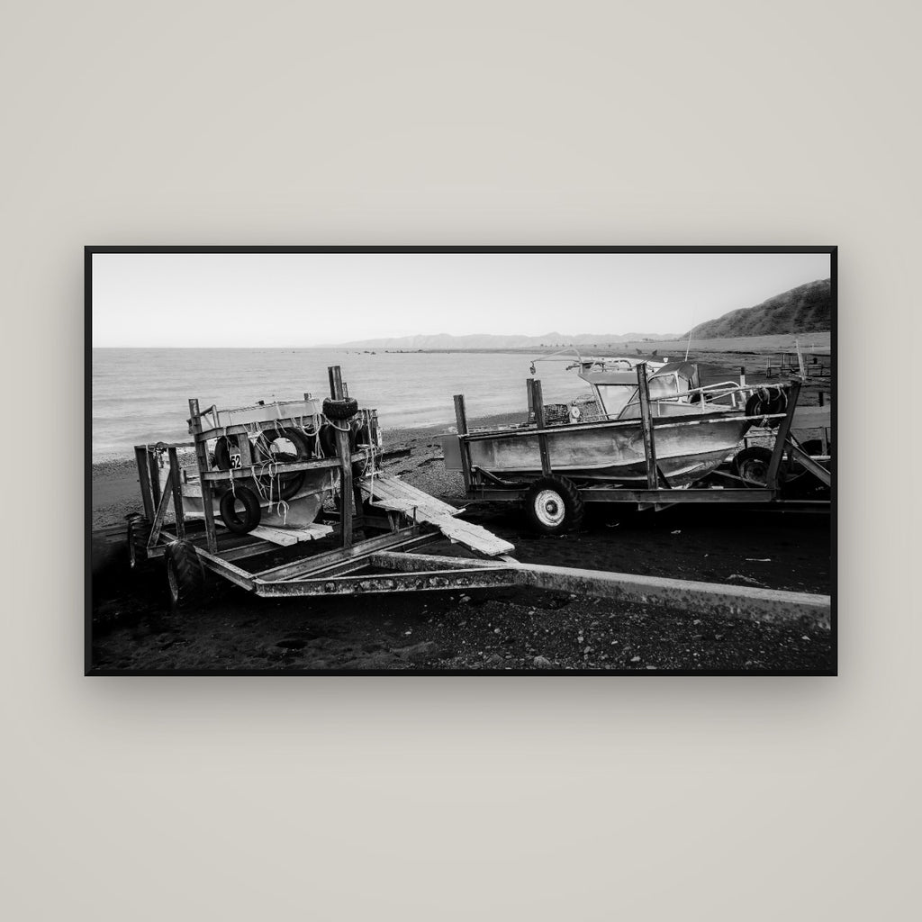 Boats in the Bay, Cape Palliser — Basel Black Matte, 160×90 cm. New Zealand fine art wall art by Stephen Milner.