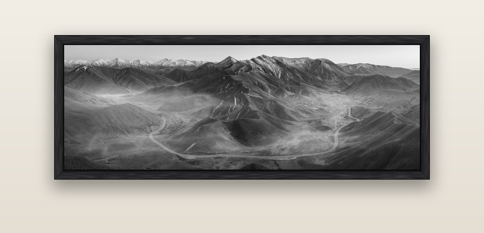 Dawn's Embrace, Lindis Pass Chronicles — black float frame canvas, 152 × 56 cm. New Zealand fine art landscape wall art by Stephen Milner.