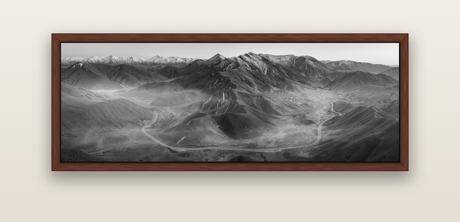 Dawn's Embrace, Lindis Pass Chronicles — brown float frame canvas, 152 × 56 cm. New Zealand fine art landscape wall art by Stephen Milner.