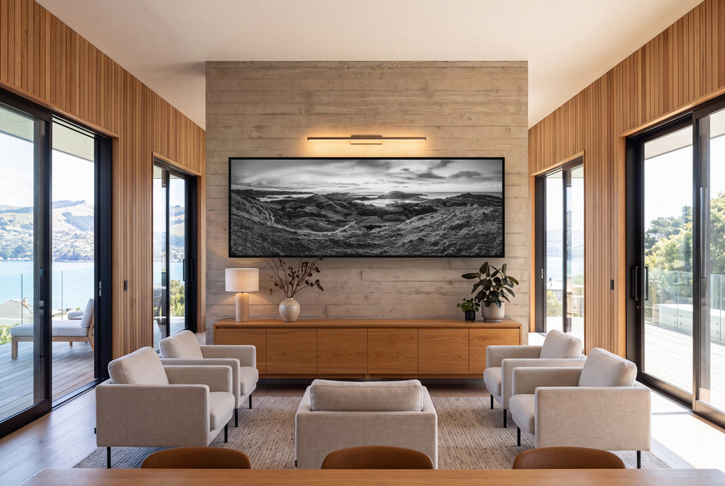 Dawn's Embrace, Otago Peninsula Panorama shown as large black and white wall art in a styled room, fine art by Stephen Milner.