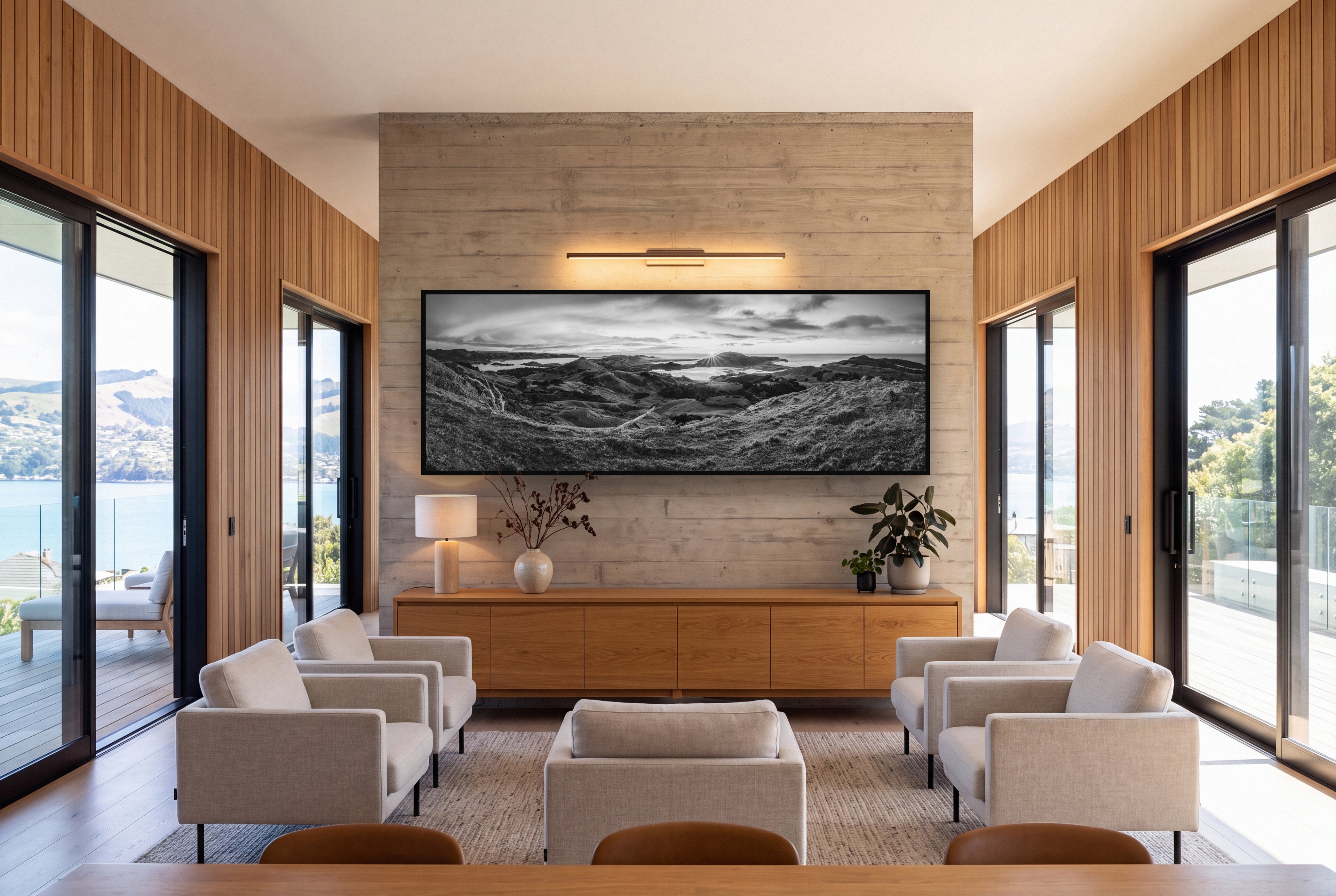 Dawn's Embrace, Otago Peninsula Panorama shown as large black and white wall art in a styled room, fine art by Stephen Milner.