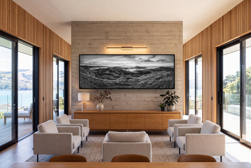 Dawn's Embrace, Otago Peninsula Panorama shown as large black and white wall art in a styled room, fine art by Stephen Milner.