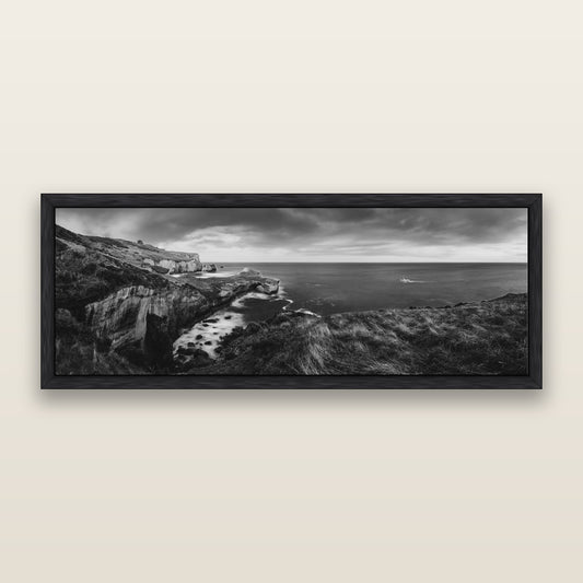 Dunedin Serenity, Tunnel Beach Sunset, black and white framed metallic canvas print, Black frame. New Zealand fine art wall art by Stephen Milner.