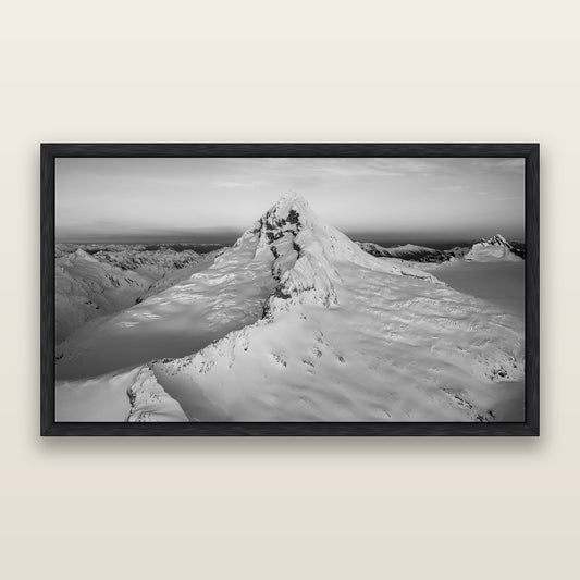 Elysian Majesty, Mount Aspiring's Evening Embrace, black and white framed metallic canvas print, Black frame. New Zealand fine art wall art by Stephen Milner.