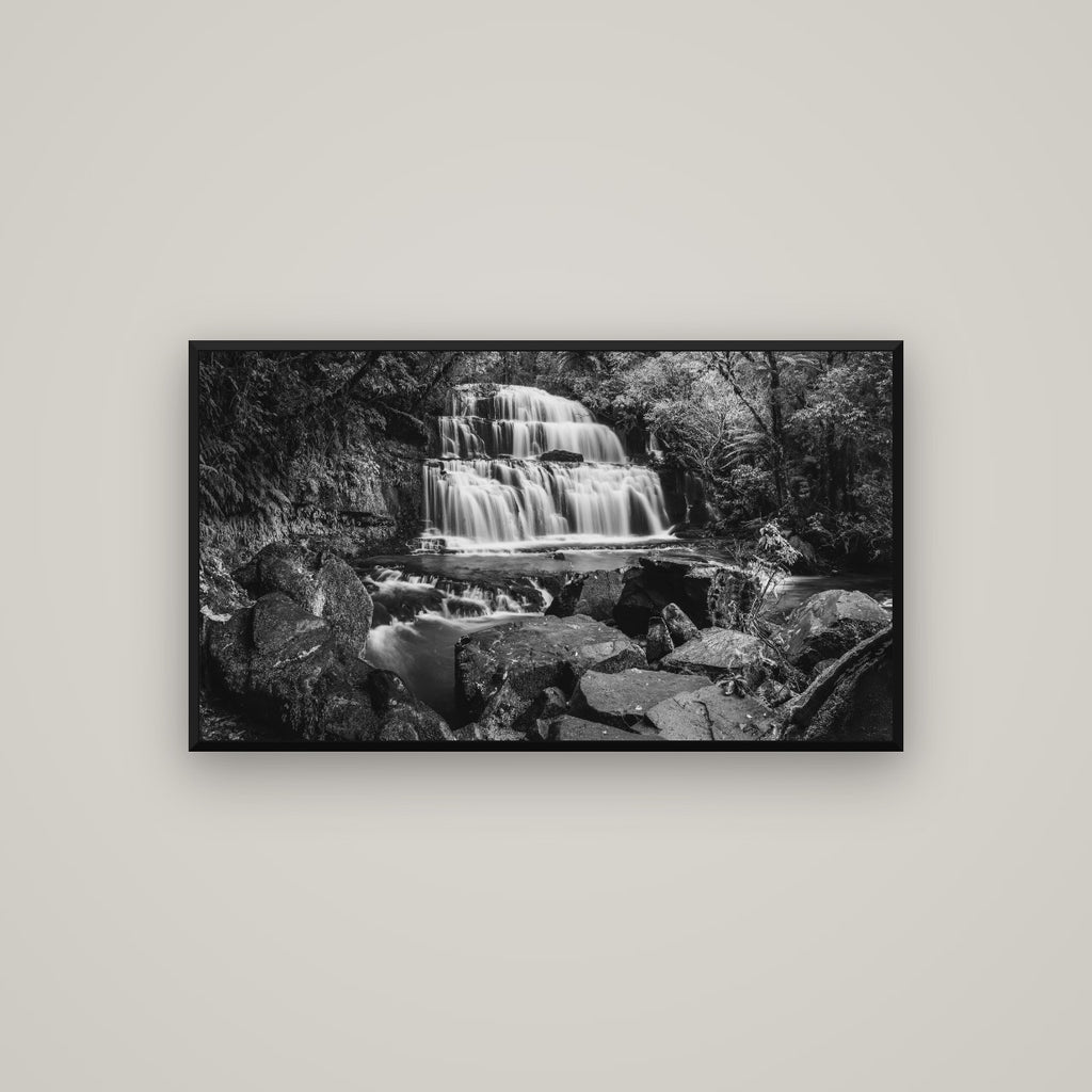 Elysian Serenity, Purakaunui Falls — Basel Black Matte, 107×60 cm. New Zealand fine art wall art by Stephen Milner.