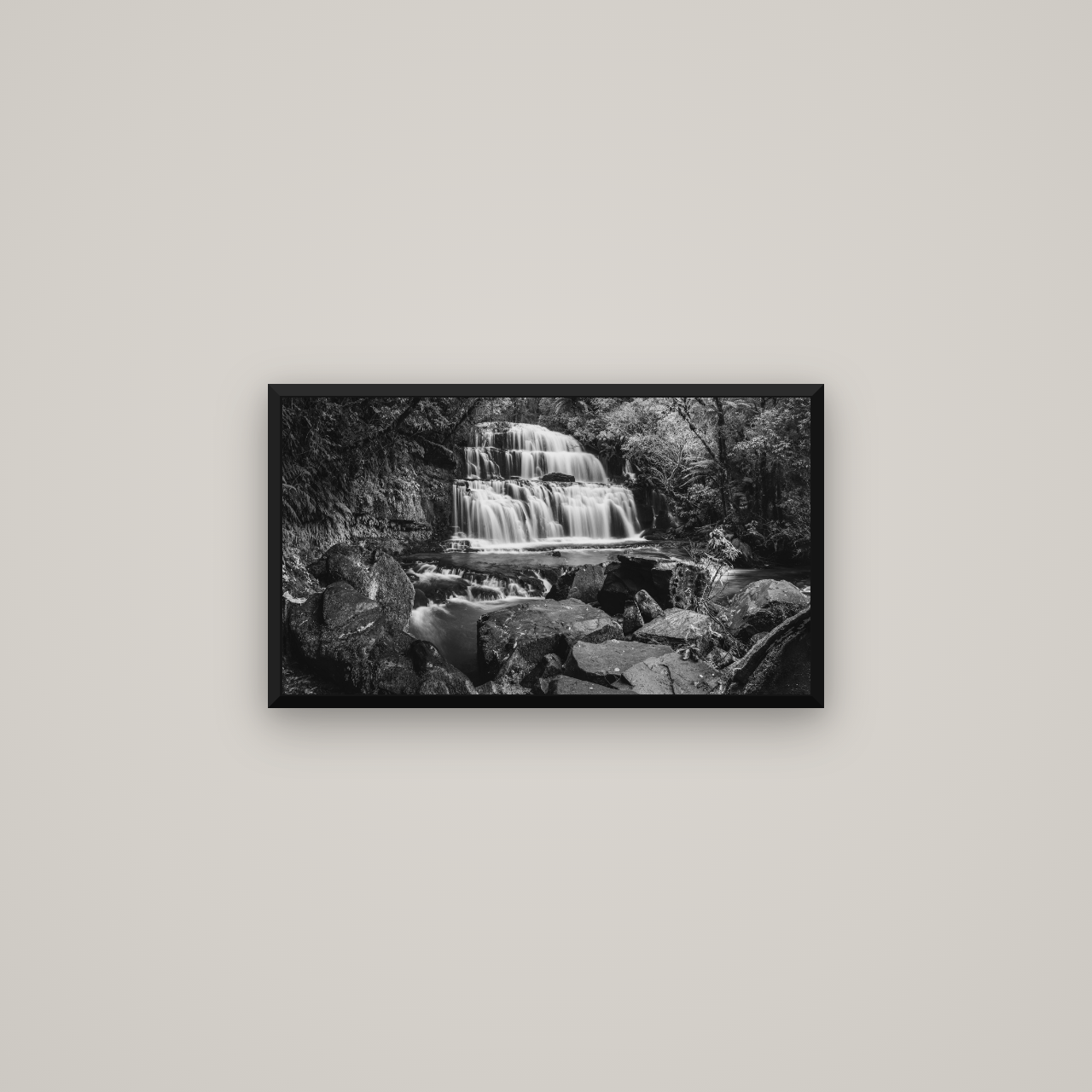 Elysian Serenity, Purakaunui Falls — Basel Black Matte, 64×36 cm. New Zealand fine art wall art by Stephen Milner.