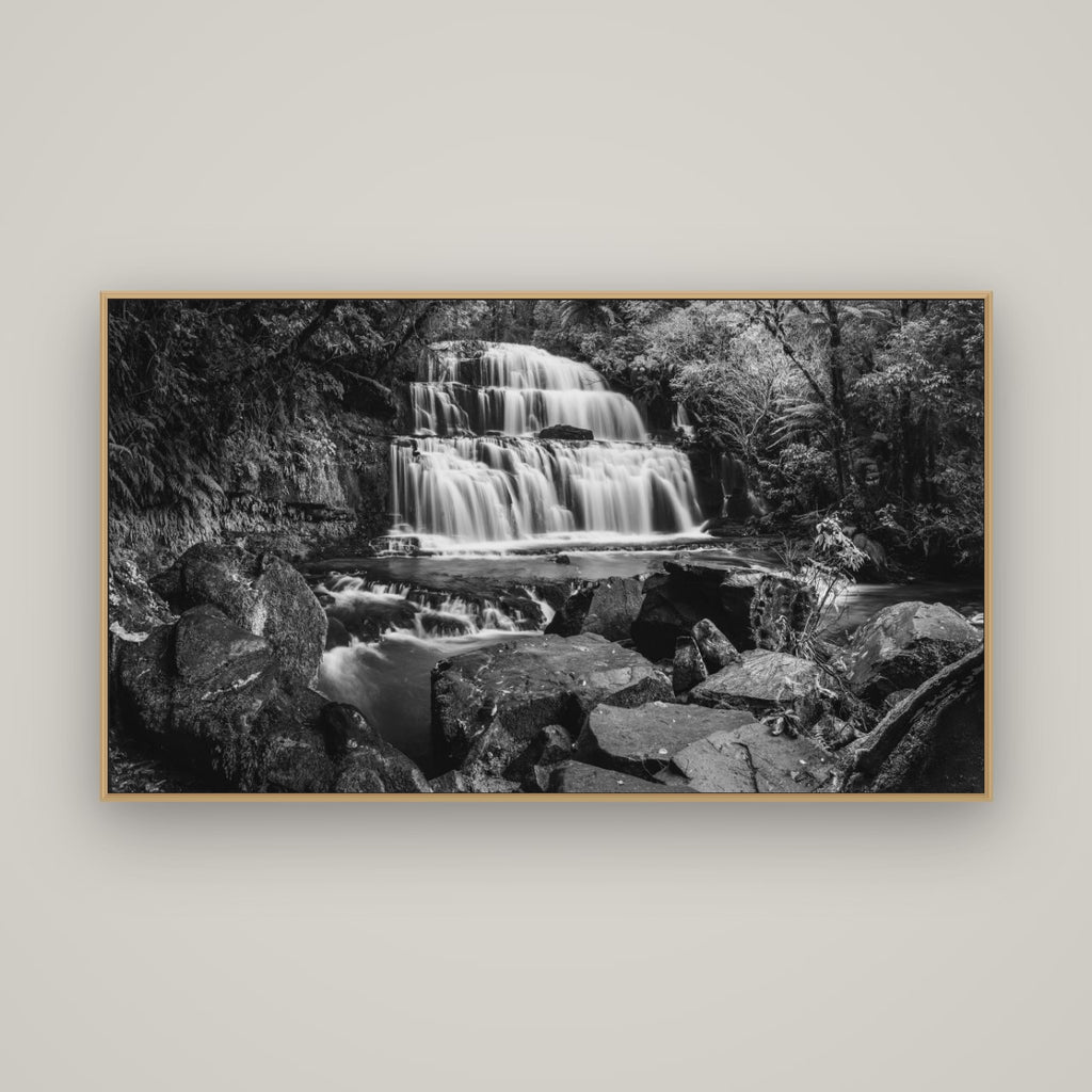 Elysian Serenity, Purakaunui Falls, Basel Natural Oak, 160×90 cm. New Zealand fine art photograph under matte acrylic glass.