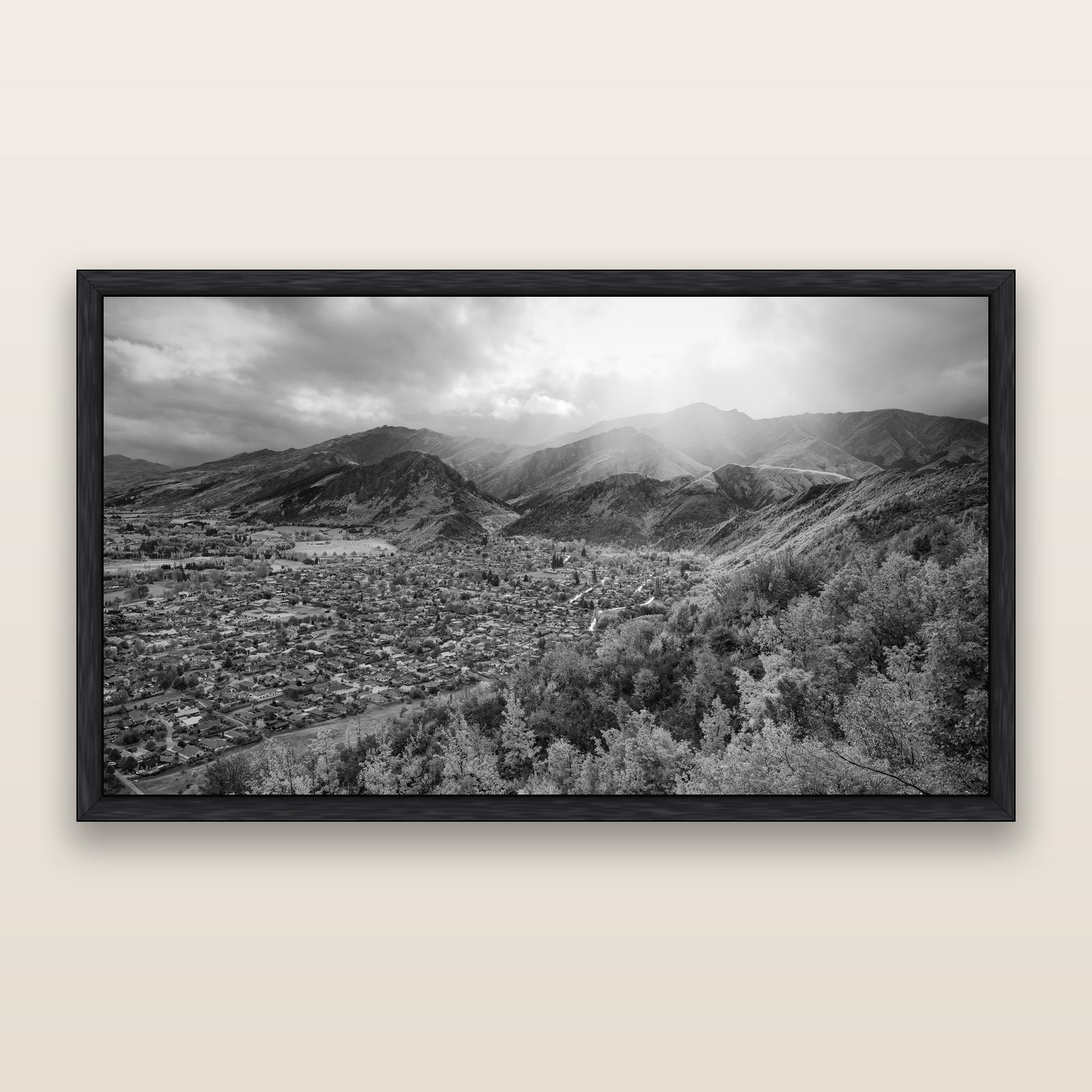 Light Over the Valley, Arrowtown, black and white framed metallic canvas print, Black frame. New Zealand fine art wall art by Stephen Milner.