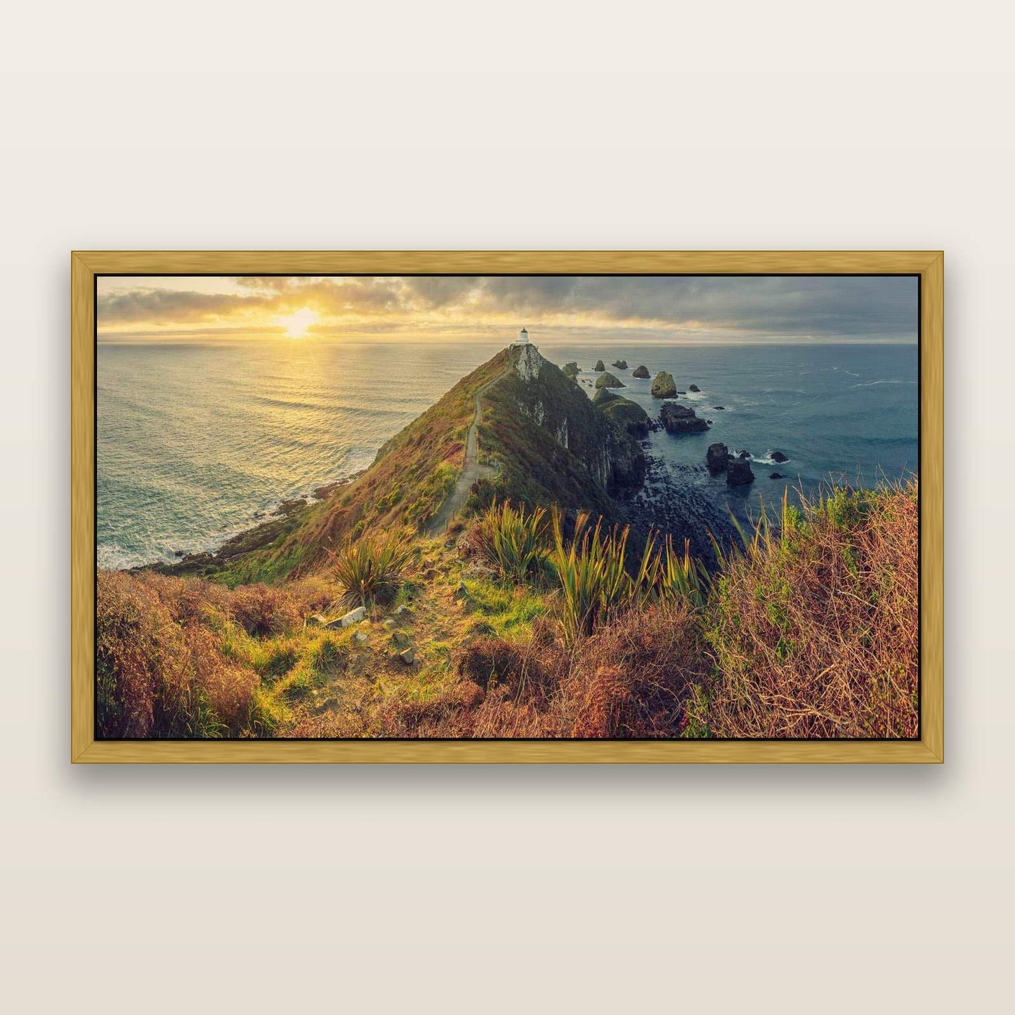 Guiding Light, Nugget Point Sunrise — framed metallic canvas print, Antique Gold frame. New Zealand fine art landscape wall art by Stephen Milner.