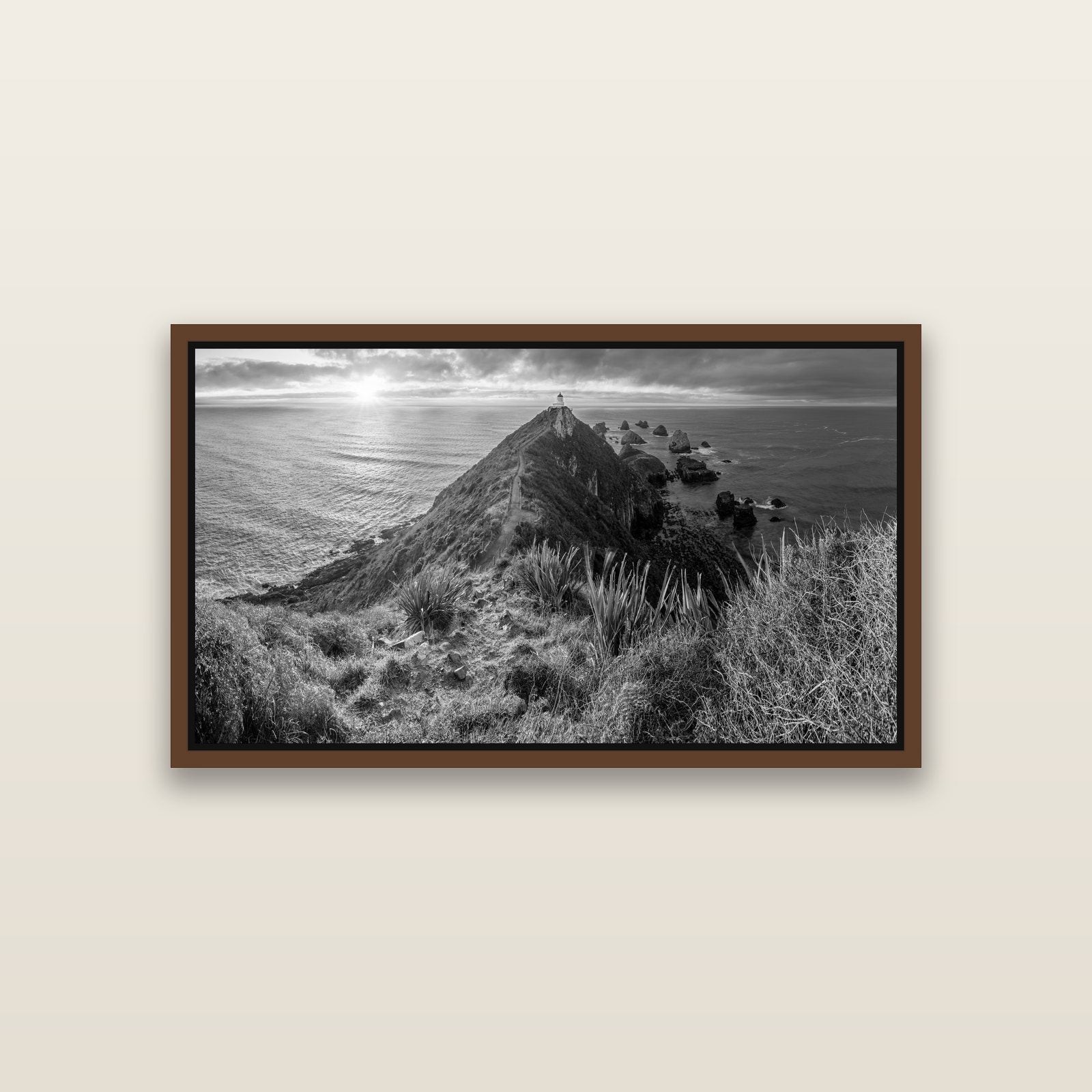 Guiding Light, Nugget Point Sunrise — Brown framed metallic canvas print, small 81 × 46 cm. New Zealand fine art landscape wall art by Stephen Milner.