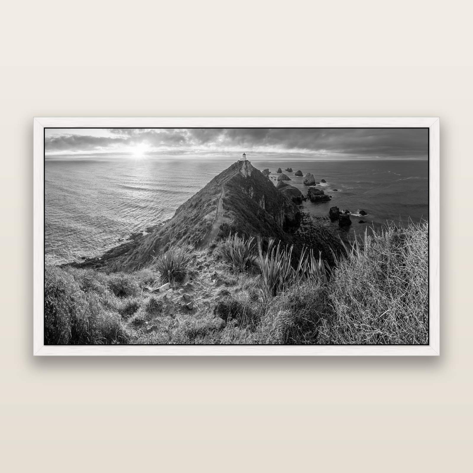 Guiding Light, Nugget Point Sunrise, black and white framed metallic canvas print, White frame. New Zealand fine art wall art by Stephen Milner.