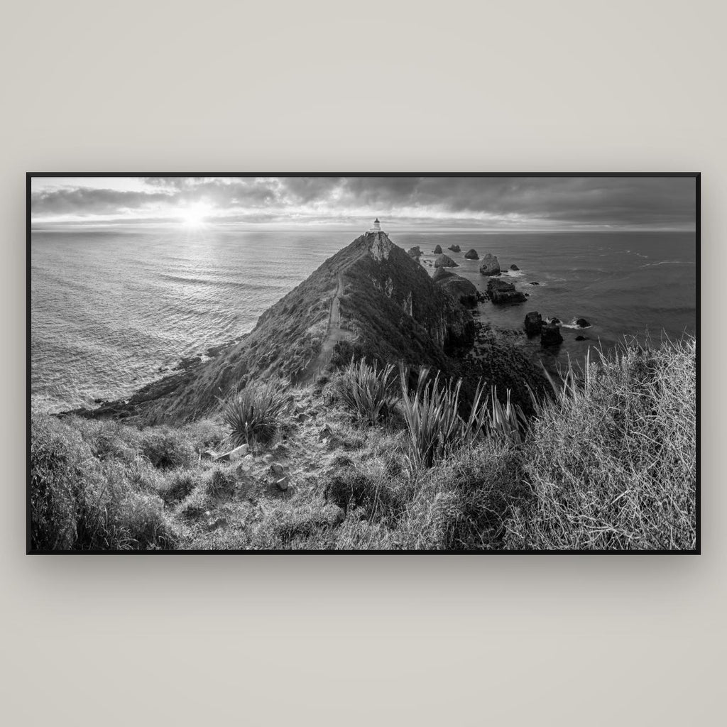 Guiding Light, Nugget Point Sunrise — Basel Black Matte, 196×110 cm. New Zealand fine art wall art by Stephen Milner.