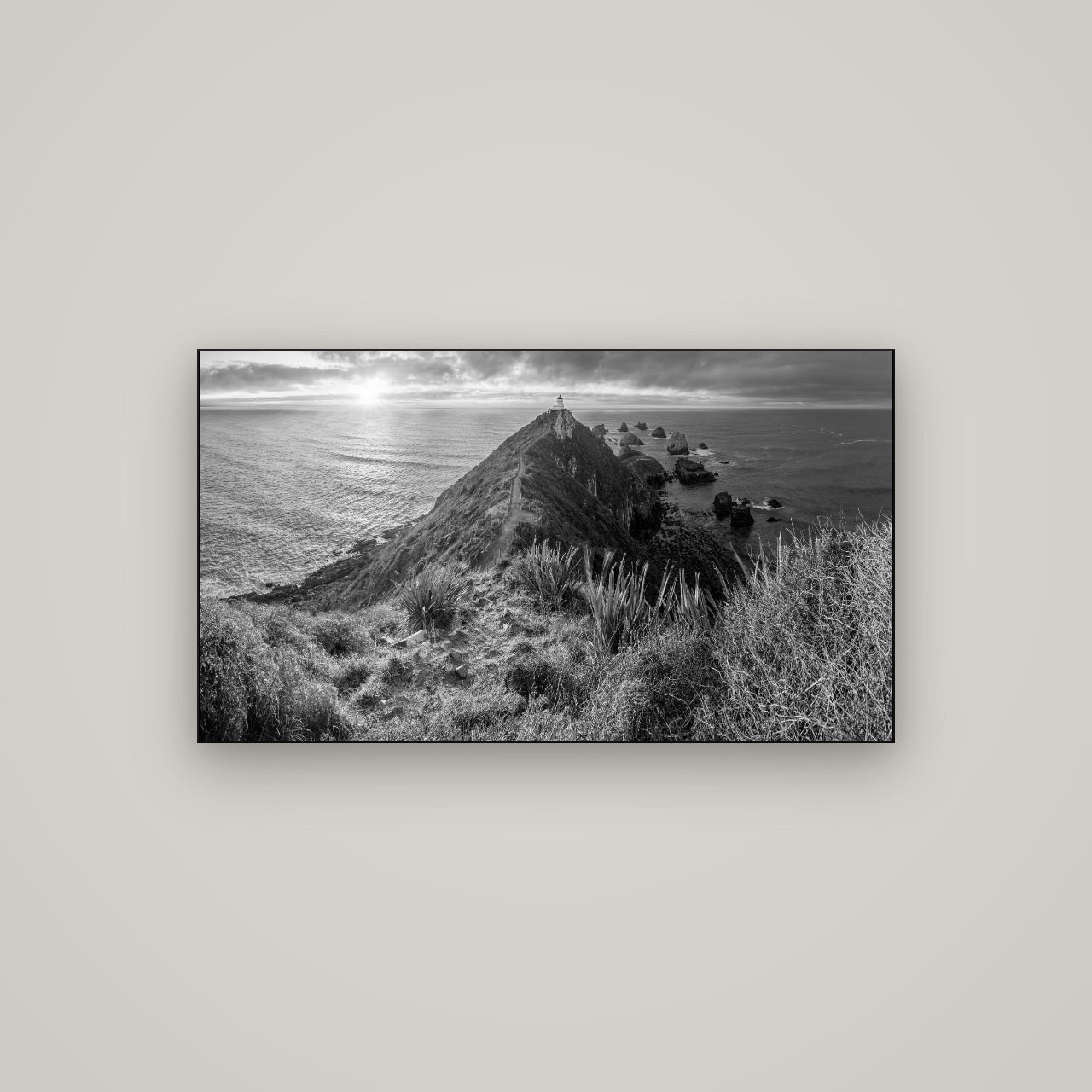 Guiding Light, Nugget Point Sunrise — Slimline Black, 107×60 cm. New Zealand fine art wall art by Stephen Milner.