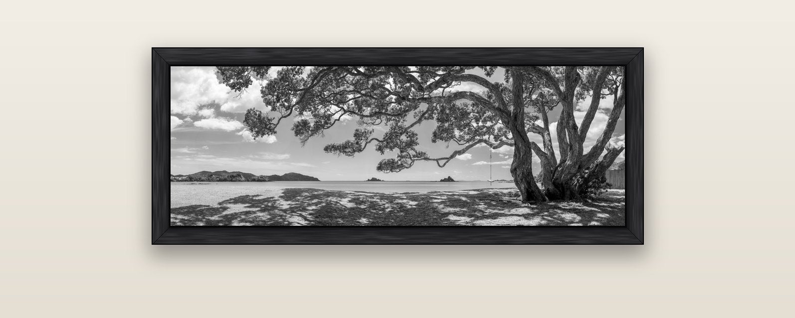 Harbour of Summer Light, Pōhutukawa Bloom, Bay of Islands — black float frame canvas, 102 × 36 cm. New Zealand fine art landscape wall art by Stephen Milner.