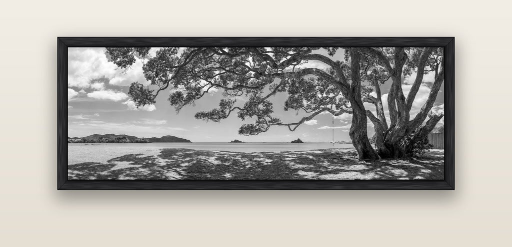Harbour of Summer Light, Pōhutukawa Bloom, Bay of Islands — black float frame canvas, 152 × 56 cm. New Zealand fine art landscape wall art by Stephen Milner.