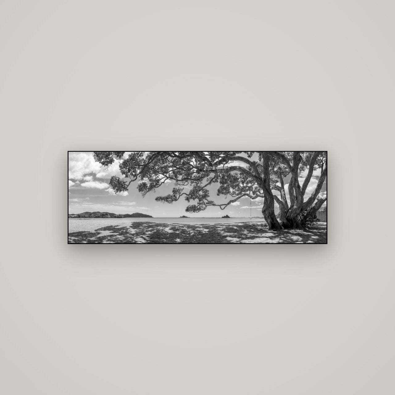 Harbour of Summer Light, Pōhutukawa Bloom, Bay of Islands — Slimline Black, 113×40 cm. New Zealand fine art wall art by Stephen Milner.
