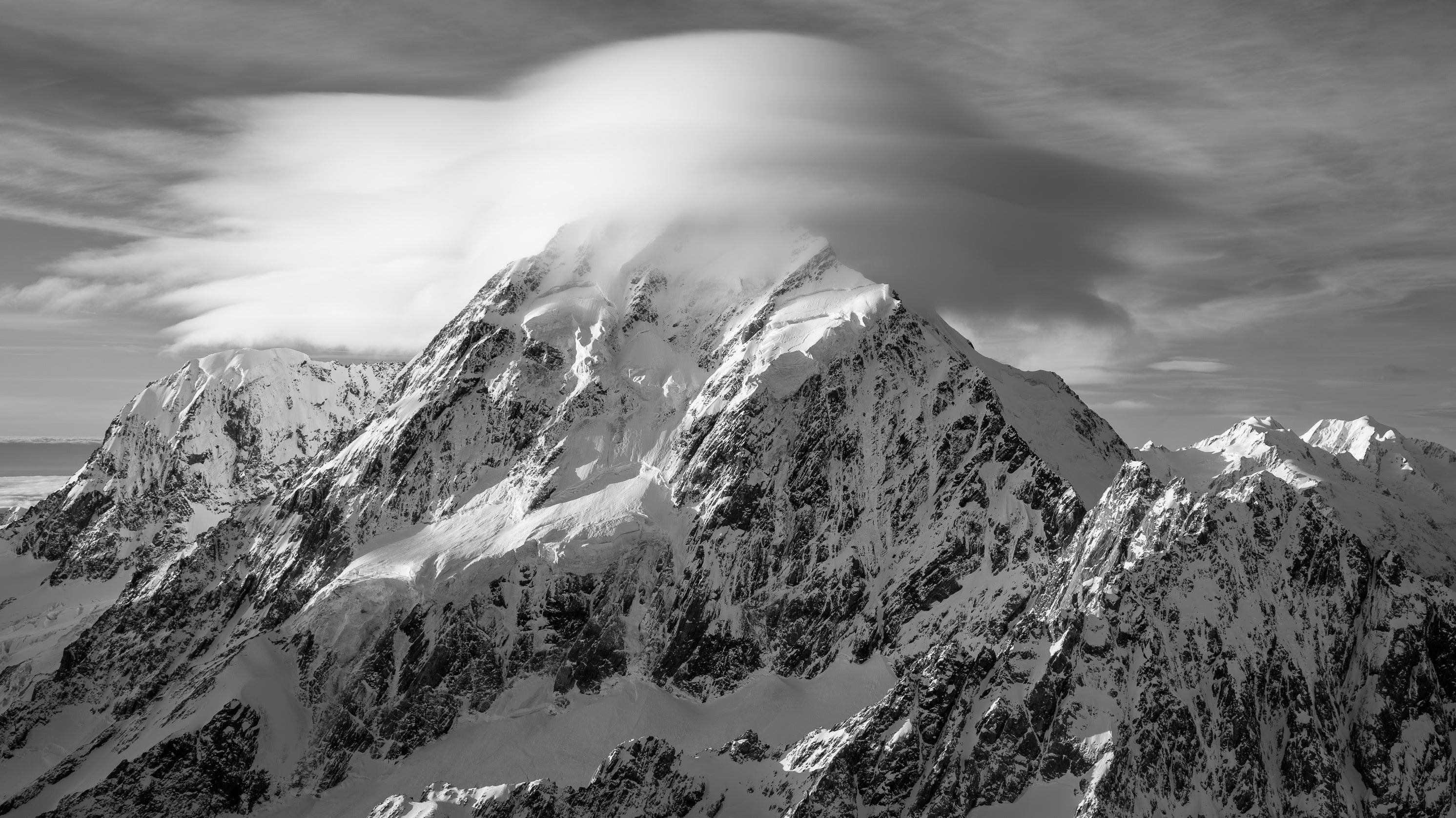 Aoraki Mount Cook under a lenticular cloud, black and white fine art photograph by Stephen Milner