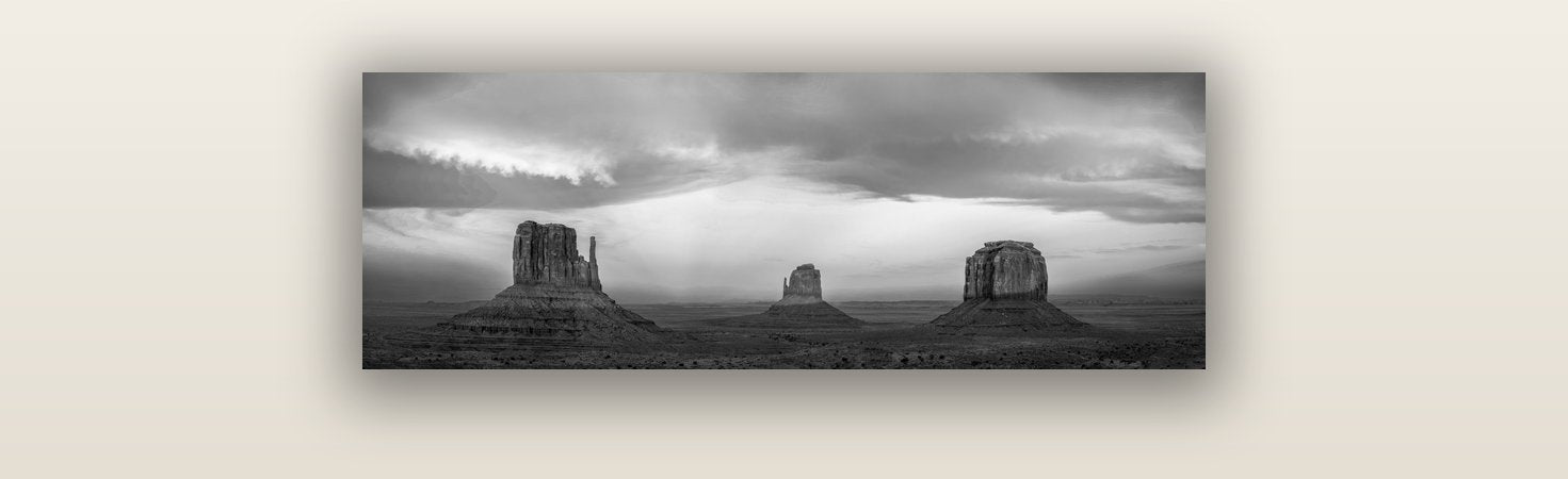 Majestic Guardians, Monument Valley Sunset Spectacle — acrylic glass print, 76 × 25 cm. New Zealand fine art landscape wall art by Stephen Milner.