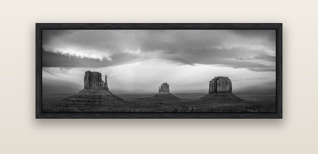 Majestic Guardians, Monument Valley Sunset Spectacle — black float frame canvas, 152 × 56 cm. New Zealand fine art landscape wall art by Stephen Milner.