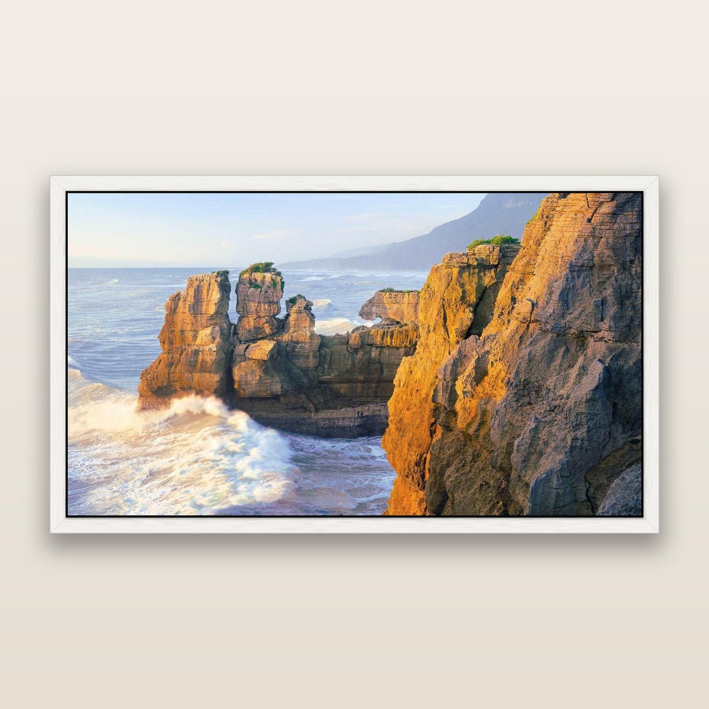 Punakaiki Sculptures, South Island — framed metallic canvas print, White frame. New Zealand fine art landscape wall art by Stephen Milner.