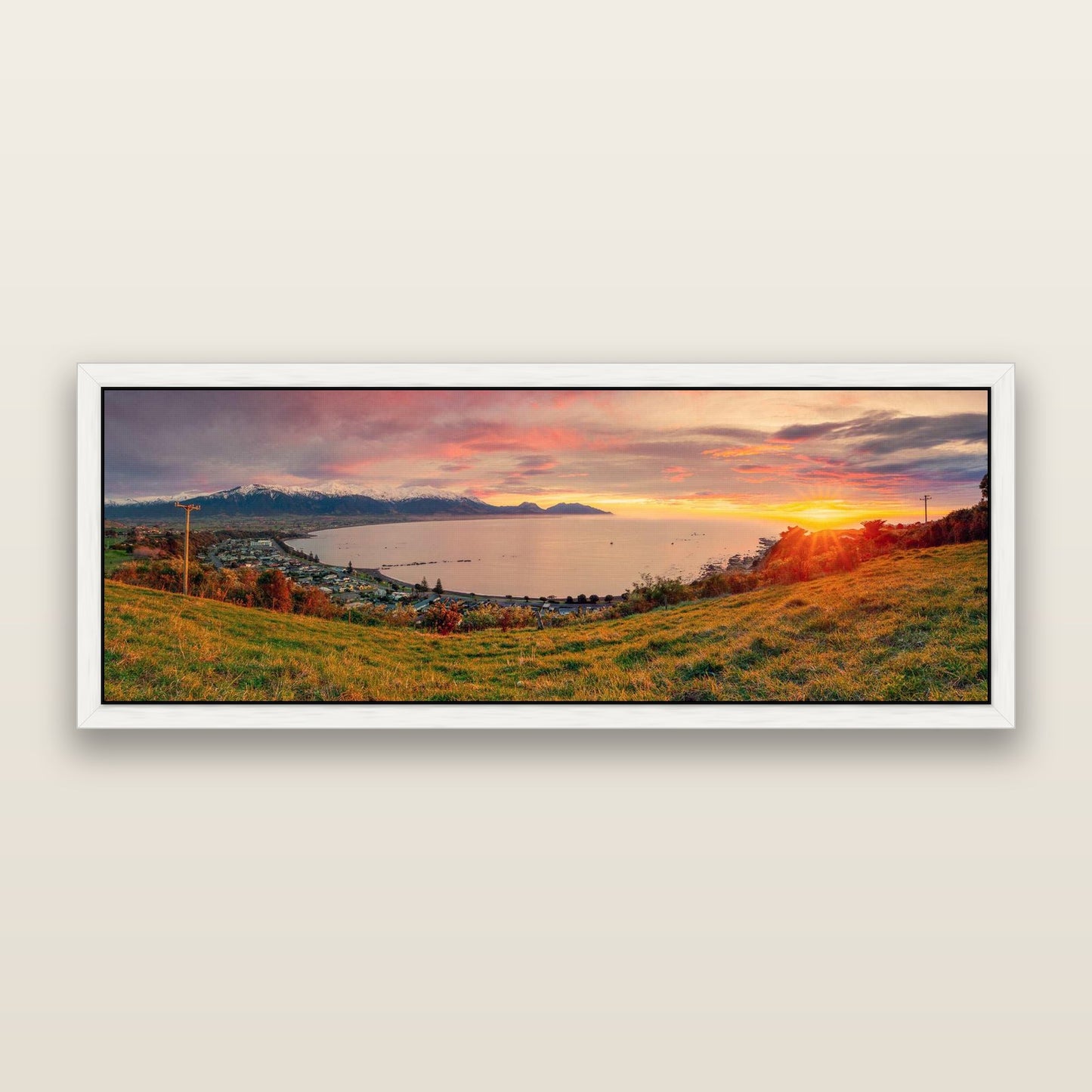 Radiant Awakening, Kaikōura's Coastal Majesty — framed metallic canvas print, White frame. New Zealand fine art landscape wall art by Stephen Milner.