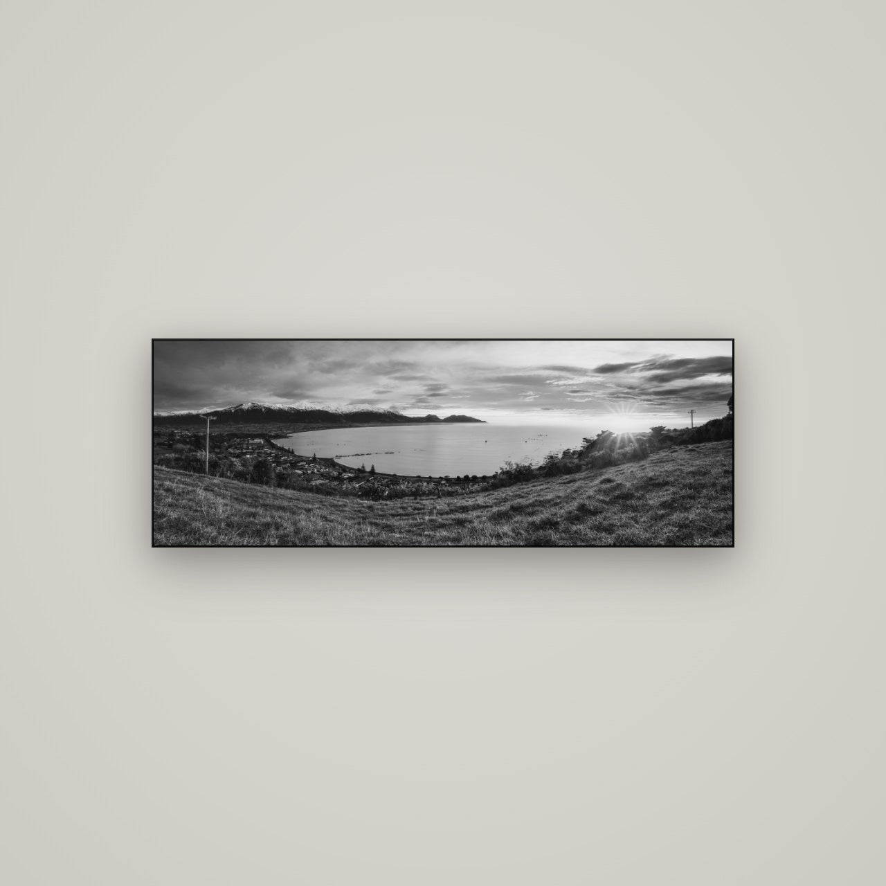 Radiant Awakening, Kaikōura's Coastal Majesty — Slimline Black, 113×40 cm. New Zealand fine art wall art by Stephen Milner.