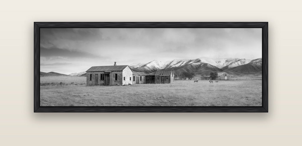 Resilience in Ruin, Echoes of a Forgotten Farm — black float frame canvas, 152 × 56 cm. New Zealand fine art landscape wall art by Stephen Milner.