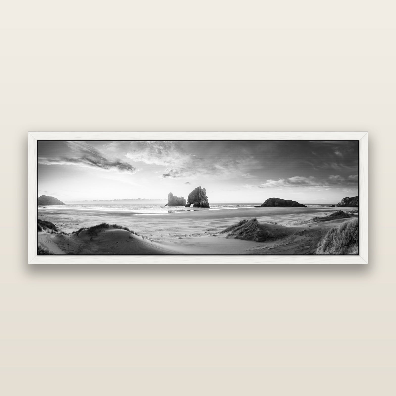 Sands of Time, Wharariki Beach, black and white framed metallic canvas print, White frame. New Zealand fine art wall art by Stephen Milner.