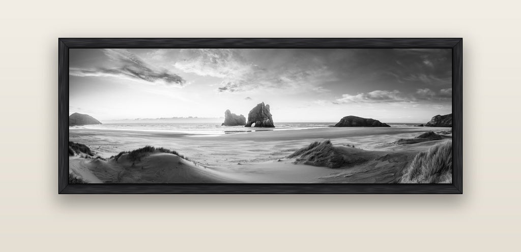Sands of Time, Wharariki Beach — black float frame canvas, 152 × 56 cm. New Zealand fine art landscape wall art by Stephen Milner.