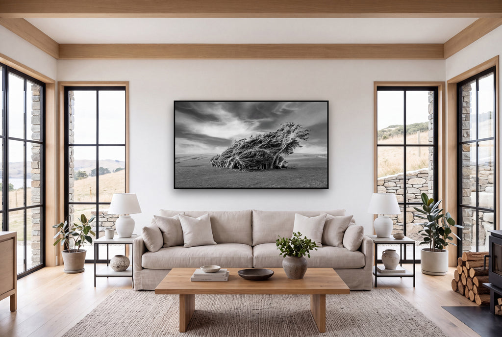 Sculpted by the Winds, Trees of Slope Point shown as large black and white wall art in a styled room, fine art by Stephen Milner.