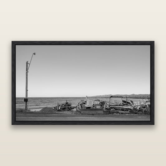 Seaside Work, Cape Palliser, black and white framed metallic canvas print, Black frame. New Zealand fine art wall art by Stephen Milner.