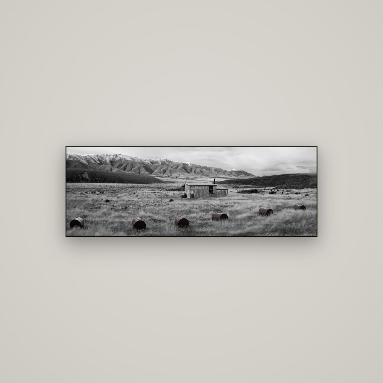 Solitude in the Wild, Barrels of Resilience — Slimline Black, 113×40 cm. New Zealand fine art wall art by Stephen Milner.