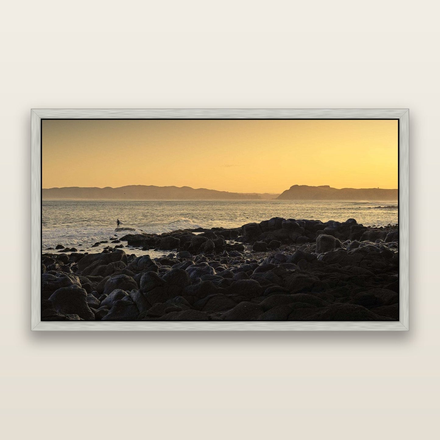 Surfing the Sunrise, Raglan — framed metallic canvas print, Antique Silver frame. New Zealand fine art landscape wall art by Stephen Milner.