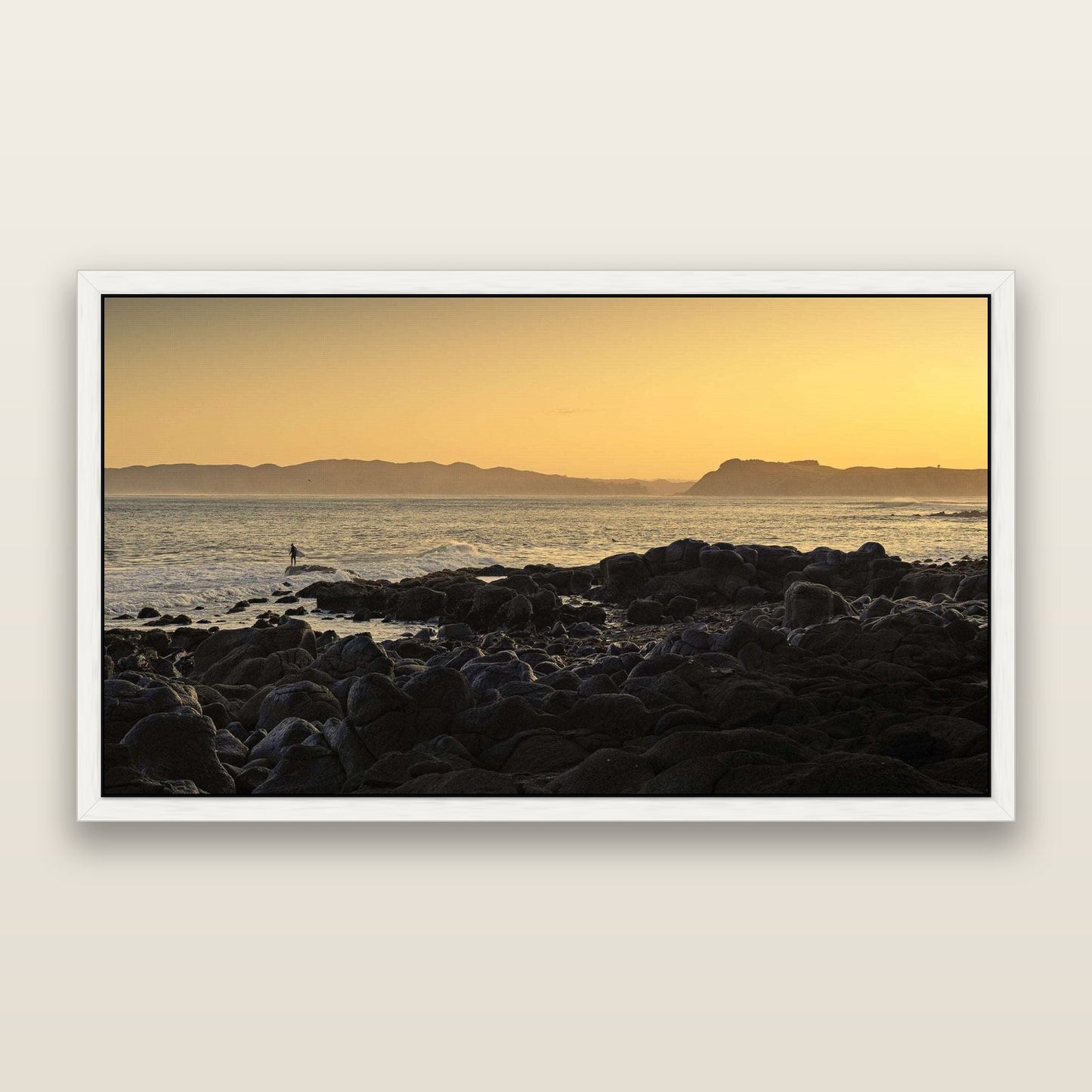 Surfing the Sunrise, Raglan — framed metallic canvas print, White frame. New Zealand fine art landscape wall art by Stephen Milner.