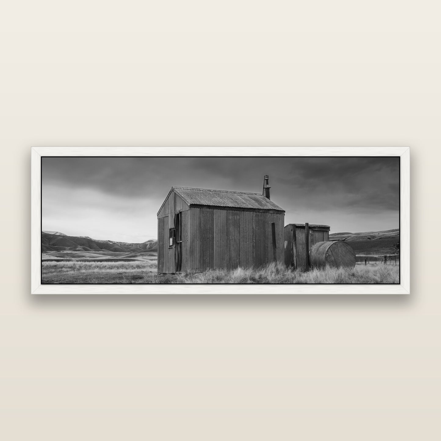Whispers of Solitude, The Iron Hut — black and white framed metallic canvas print, White frame. New Zealand fine art wall art by Stephen Milner.
