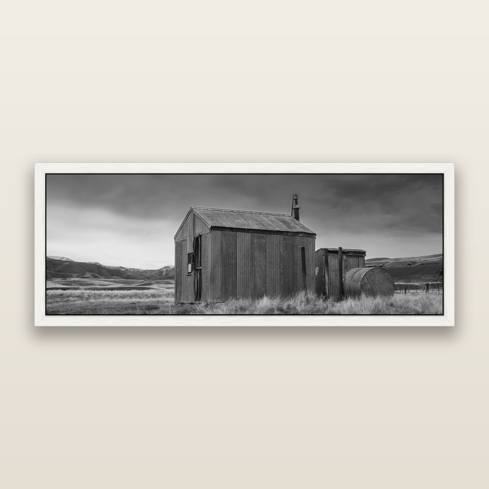 Whispers of Solitude, The Iron Hut, black and white framed metallic canvas print, White frame. New Zealand fine art wall art by Stephen Milner.