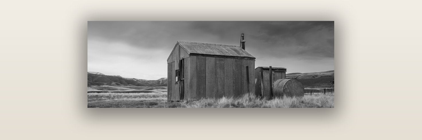 Whispers of Solitude, The Iron Hut — acrylic glass print, 91 × 30 cm. New Zealand fine art landscape wall art by Stephen Milner.