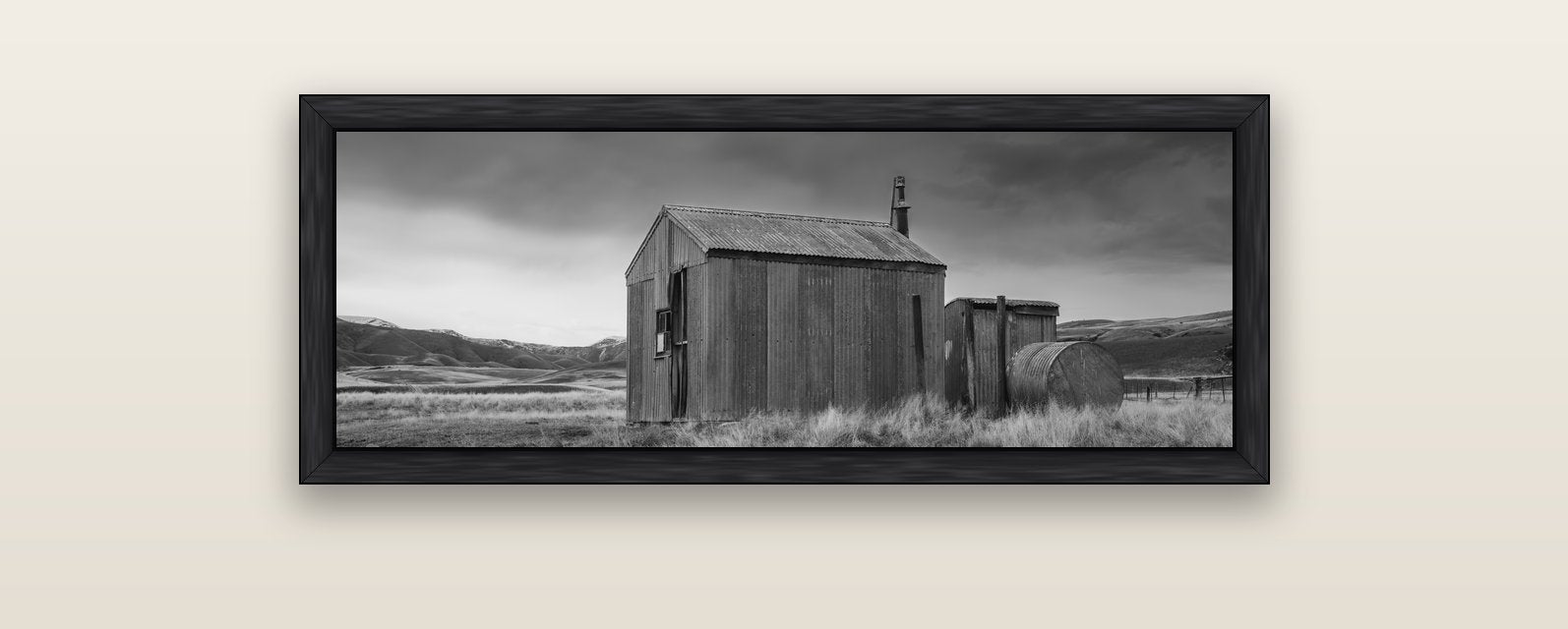 Whispers of Solitude, The Iron Hut — black float frame canvas, 102 × 36 cm. New Zealand fine art landscape wall art by Stephen Milner.