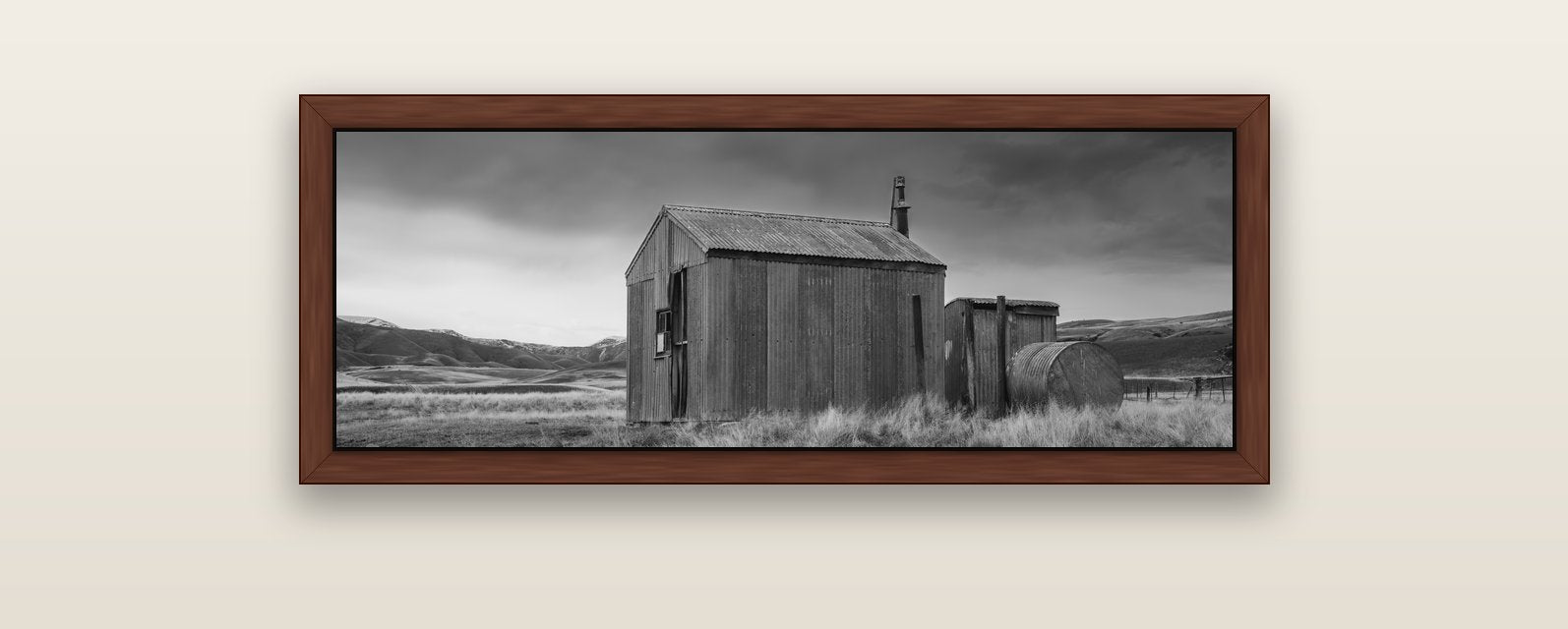 Whispers of Solitude, The Iron Hut — brown float frame canvas, 102 × 36 cm. New Zealand fine art landscape wall art by Stephen Milner.