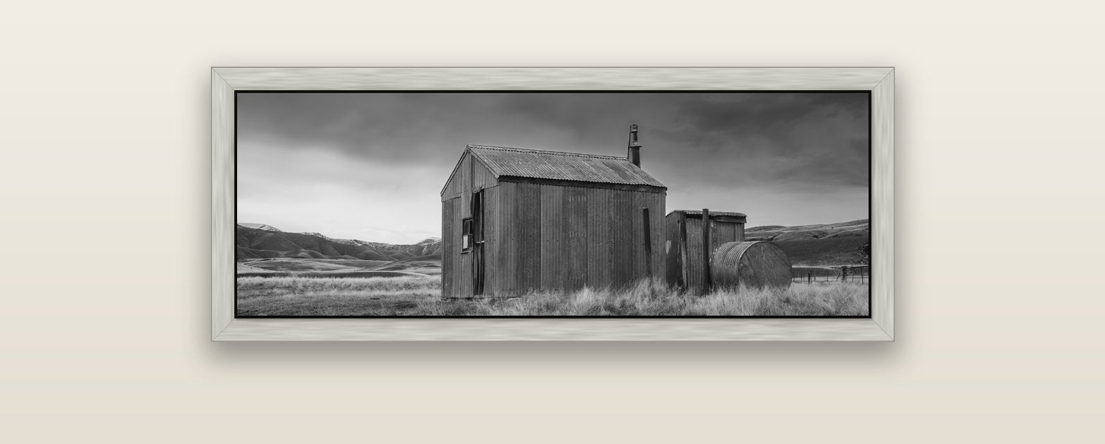 Whispers of Solitude, The Iron Hut — silver float frame canvas, 102 × 36 cm. New Zealand fine art landscape wall art by Stephen Milner.