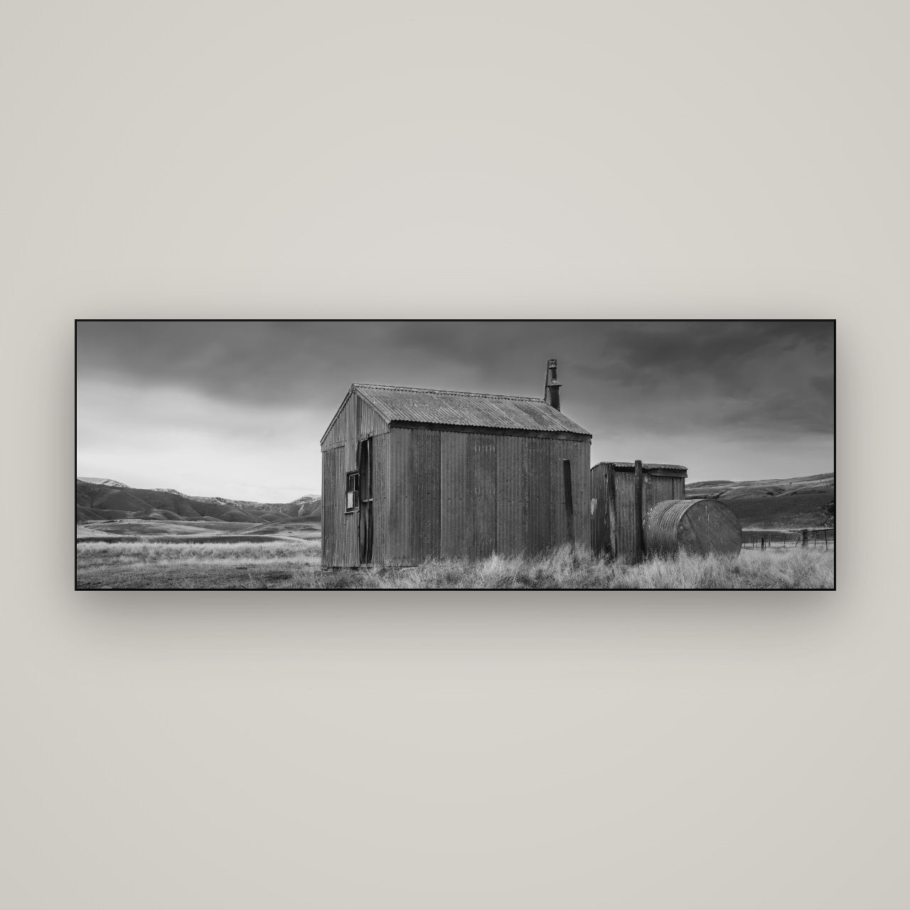 Whispers of Solitude, The Iron Hut — Slimline Black, 170×60 cm. New Zealand fine art wall art by Stephen Milner.