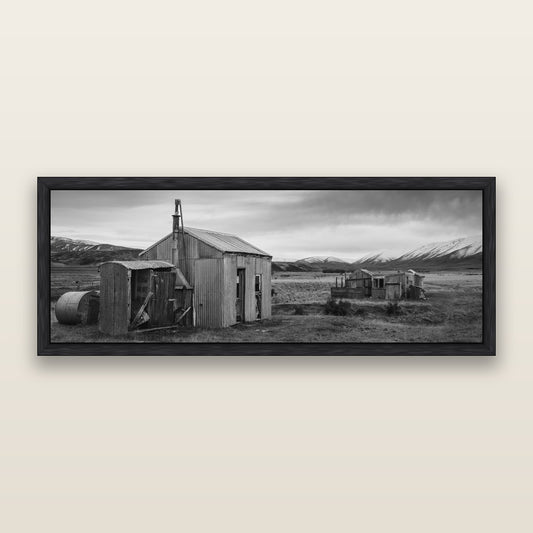 Whispers of Solitude, The Station Huts — black and white framed metallic canvas print, Black frame. New Zealand fine art wall art by Stephen Milner.